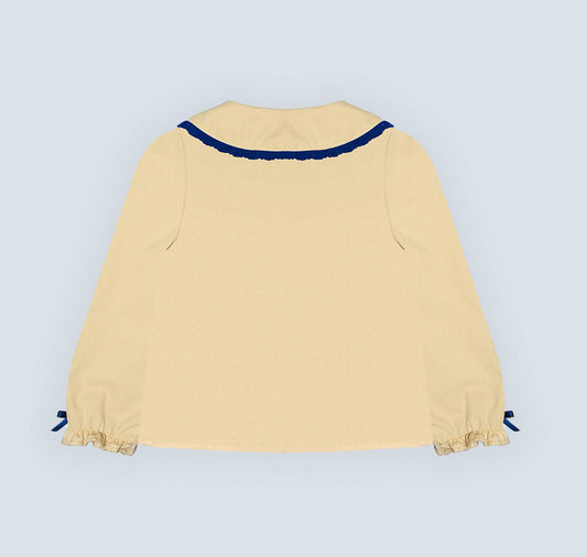 Chemise jaune pour fille.