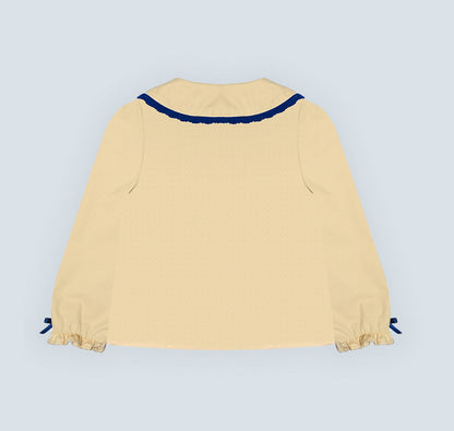 Chemise jaune pour fille.