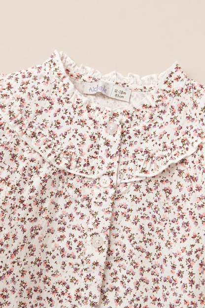 Blouse bébé fleurie à col volant – Raffinement & douceur