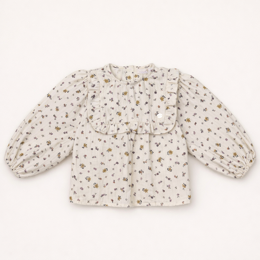 Blouse bébé écrue à fleurs avec col volanté – Élégance naturelle & douceur