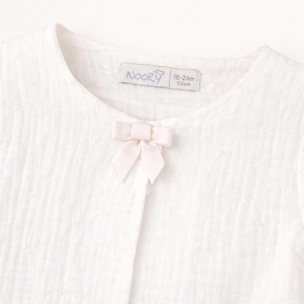 Veste bébé écrue en gaze de coton – Élégance & légèreté
