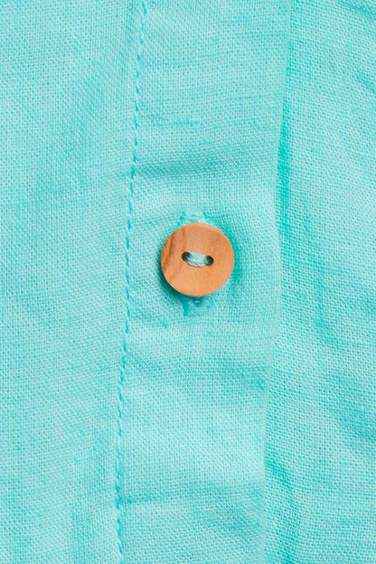 Robe fille turquoise à volants – Fraîcheur & élégance estivale